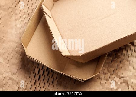 Used empty cardboard boxes and wrapping soft paper. Recycling materials. Top view. Stock Photo
