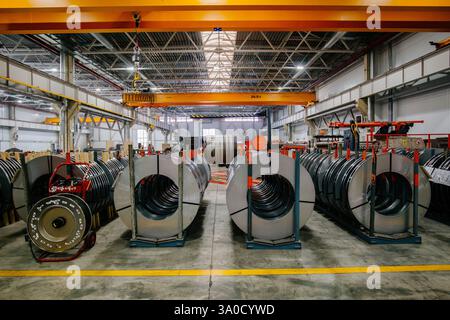 Rolls of perforated galvanized steel sheet in metalworking factory. Stock Photo