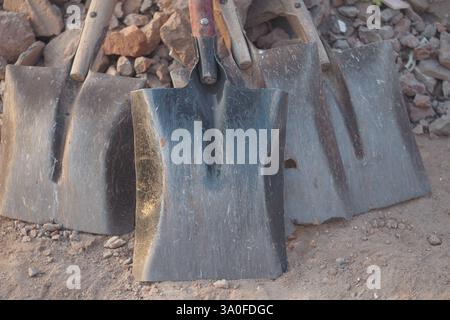 Various shovels displayed on the ground in a construction area Stock Photo