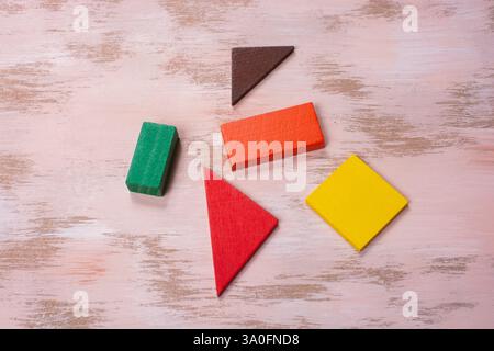 Concept of creative logical thinking. Different colorful wooden blocks. Geometric shapes in different colors. Stock Photo
