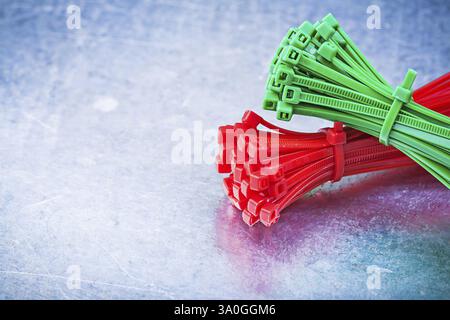 Bundle of self-locking cable ties on metallic background construction concept Stock Photo