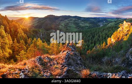 Scenic landscape in Hricov, Slovakia, on beautiful autumn sunrise with colorful leaves on trees in forest Stock Photo