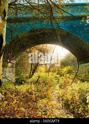 Sunlight shining through the arches of an old bridge in Nottingham, UK Stock Photo