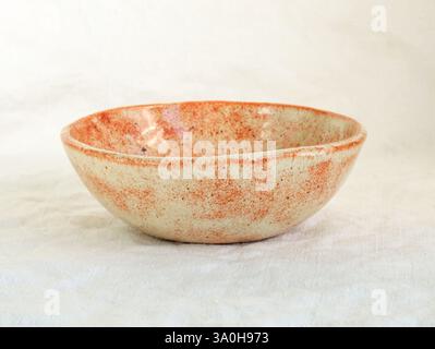 Deep ceramic plate. Ceramic plate for first courses. Plate made of clay covered with glaze. Hand-made dishes made of clay. hand-crafted bowl Stock Photo