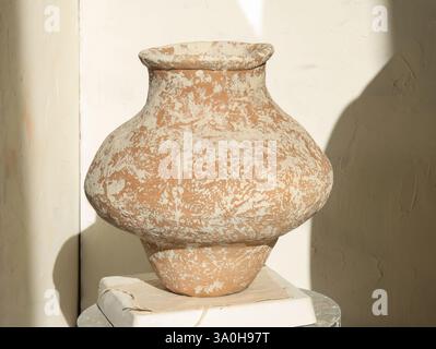 handmade ceramic vase, empty craft ceramic vase. Closeup of handbuild ceramic vase, art and artist concept on light background Stock Photo