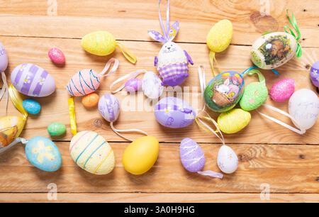 colorful Easter eggs on a wooden table top view. Easter decoration Stock Photo