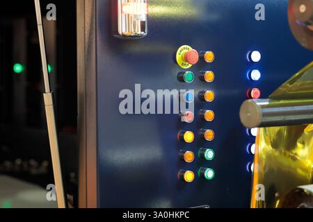 Illuminated push buttons on the control panel of industrial equipment. Selective focus. Stock Photo