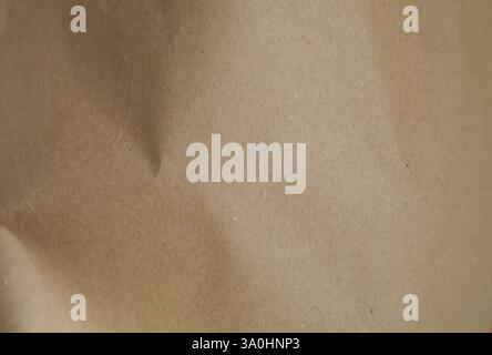 Background texture of slightly crumpled kraft paper Stock Photo
