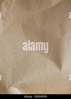 Background texture of slightly crumpled kraft paper Stock Photo
