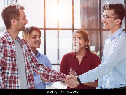 Businessman, partnership and shaking hands for human resources, hiring or greeting in workplace Stock Photo