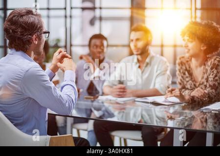 business man with executives working in background Stock Photo