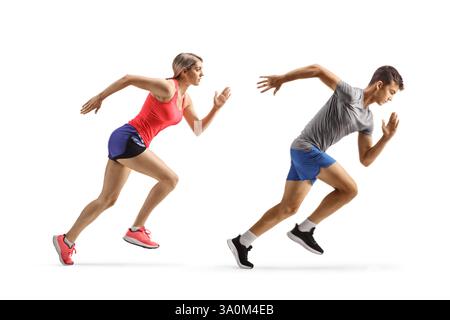Full length profile shot of a fit young man and woman running fast isolated on white background Stock Photo
