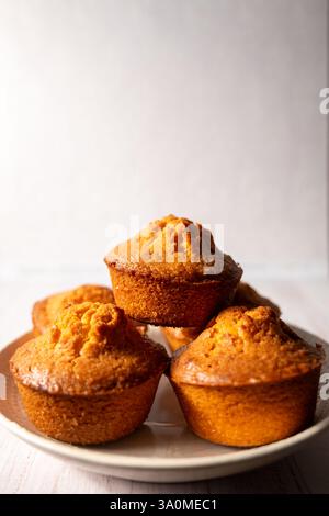 homemade lemon muffins on off white background Stock Photo