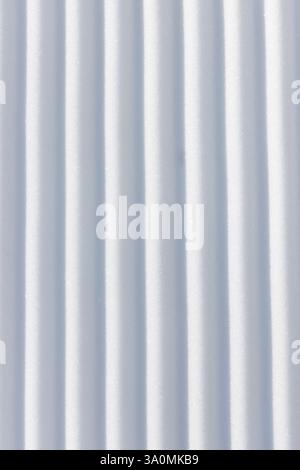 Straight vertical line grooves in white snow surface textured background Stock Photo