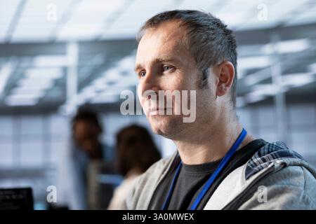 Technician optimizing data center equipment for maximum efficiency and uptime. Close up of server hub IT specialist maintaining optimal network performance, performing backups Stock Photo