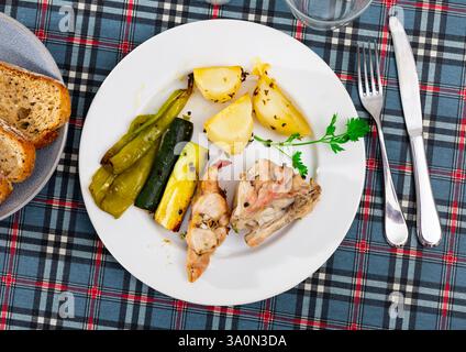 Roasted rabbit served with vegetable garnish Stock Photo