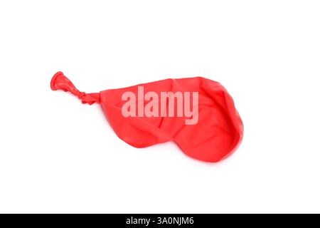 One red popped balloon isolated on white Stock Photo