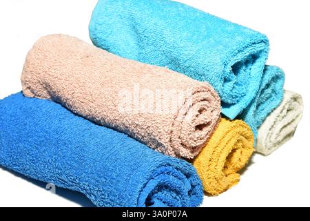 Terry short hand towels lie in a stack on a white background. Side view. Stock Photo
