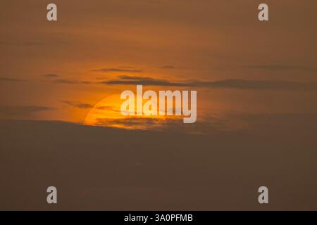 Beautiful big sun set in the middle of the cloud, Isolated huge sun at twilight, Magical moment at the sky Stock Photo