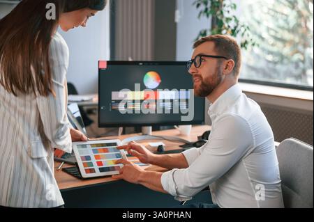 Creative job. Two designers are working together in the modern office. Stock Photo