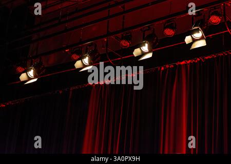 Spotlights and red velvet stage curtain Stock Photo