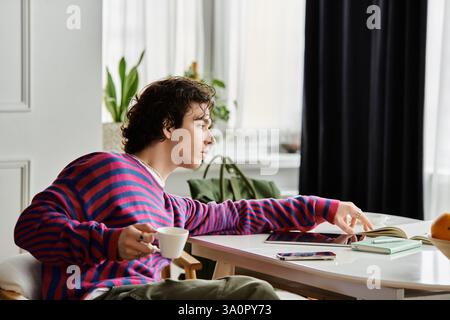 Non binary individual enjoys a moment of tranquility in their stylish apartment Stock Photo