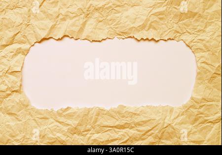 Ripped Beige Colored Paper Frame with Off-white Copy Space Stock Photo