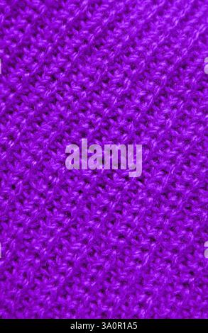 Closeup the Texture of Purple Knitted Wool Fabric in Diagonal Patterns Stock Photo