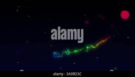 Colorful light trails and particles image over dark background Stock Photo