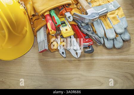 Construction tooling tool belt protective gloves hard hat Stock Photo