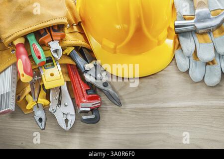 Construction tooling tool belt protective gloves building helmet Stock Photo