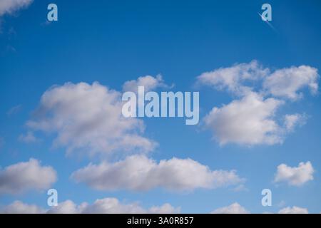 Blue 'Simpsons Sky' - clear blue sky with white fluffy clouds Stock Photo