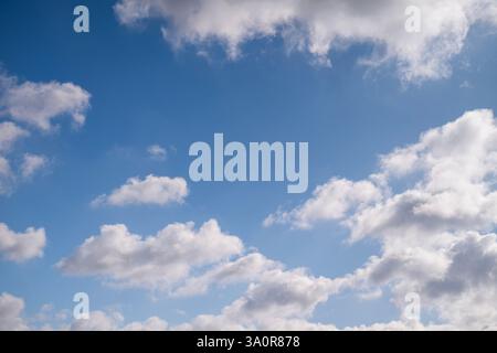 Blue 'Simpsons Sky' - clear blue sky with white fluffy clouds Stock Photo