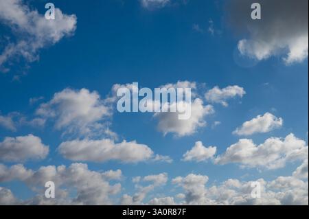 Blue 'Simpsons Sky' - clear blue sky with white fluffy clouds Stock Photo