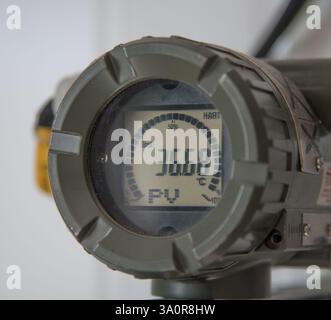 The photo shows an industrial device with a digital display. The display shows the value 36.68 and the designation PV. Stock Photo
