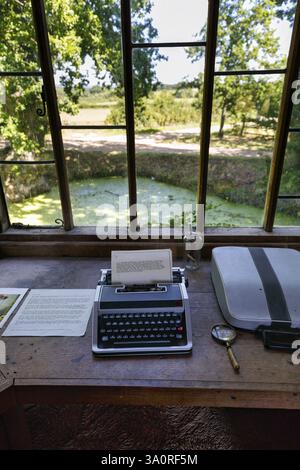 Typewriter with written text, desk in a pavilion overlooking the garden and moat, Sissinghurst Castle and Garden, Cranbrook, Kent, England, Great Brit Stock Photo