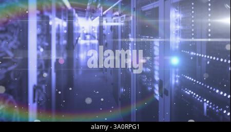 Image of light spots floating over computer servers Stock Photo