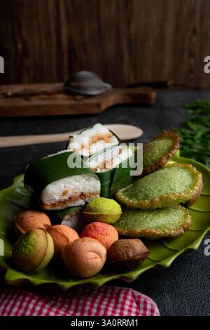 Traditional Indonesian Snacks with Lemper, Kue Cucur, and Mini Steamed Cakes Stock Photo