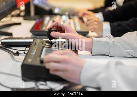 Video editor working with footage using modern video editing software and hardware control panel, creating professional content for multimedia projects. High quality photo Stock Photo