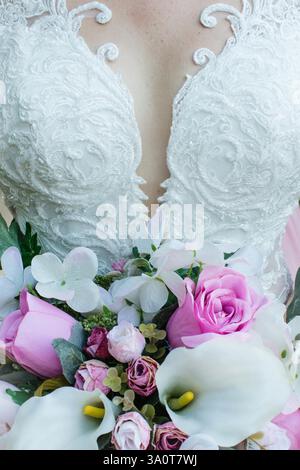Beautiful bouquet of roses in the bride's hand Stock Photo