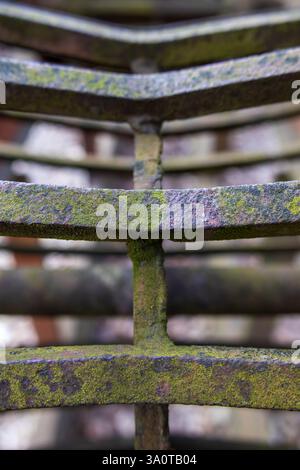 Close-up of rusted metal grates, showcasing their aged texture and intricate pattern of corrosion Stock Photo