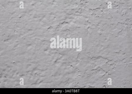 Close-up of light grey painted metal, highlighting surface textures with subtle variations in tone. Ideal for background and texture Stock Photo