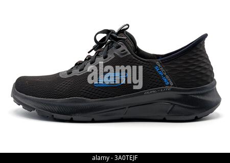 Black Skechers Slip-ins shoe cut out isolated on white background Stock Photo