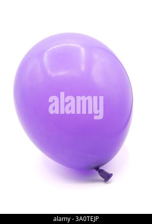Purple inflated balloon cut out isolated on white background Stock Photo