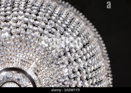 Magnificent chandelier adorned with sparkling crystals showcasing intricate craftsmanship and emitting a luxurious ambiance, perfect for decorating el Stock Photo