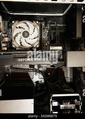 Kyiv, Ukraine - March 04, 2025: Inside view of a gaming computer showcasing GeForce RTX and advanced cooling components. Stock Photo