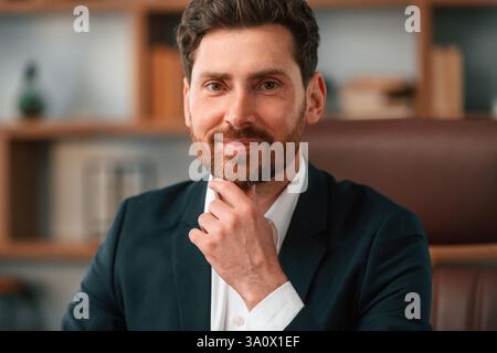 Portrait of businessman in formal clothes that is working indoors. Stock Photo