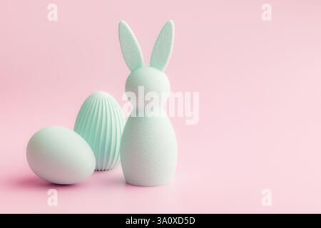 Easter decoration. Colorful eggs and bunny on a pink background. Stock Photo