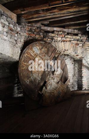 A very old, partially ruined wooden clock face from the city clock tower at Vilnius Cathedral Square Stock Photo