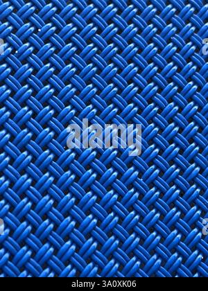 Abstract picture of a closeup of the blue fiber material of a lounge chair showing the intricate woven pattern. Stock Photo
